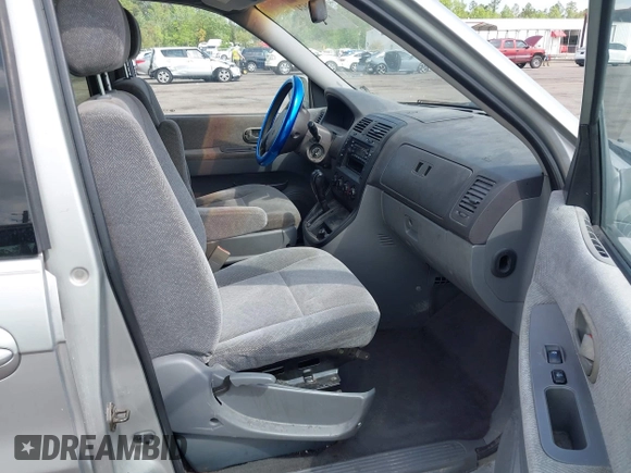 2003 Kia Sedona LX with VIN KNDUP131236417368, listed as a IAAI auction lot 41863624 with 142,896 mi miles. Bid and sale history available at carsss.com. Image 5.