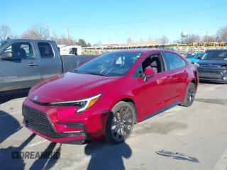 2023 Toyota Corolla Hybrid LE with VIN JTDBCMFE2PJ008826, listed as a IAAI auction lot 41428742 with 21,256 mi miles. Bid and sale history available at carsss.com. Image 2.