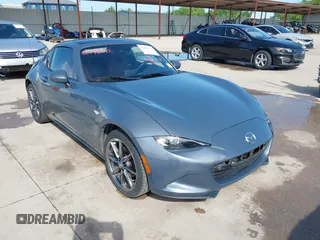 2020 Mazda MX-5 Miata Grand Touring with VIN JM1NDAM75L0418243, listed as a IAAI auction lot 42478742 with 55,099 mi miles and . Bid and sale history available at DreamBid. Image 1.