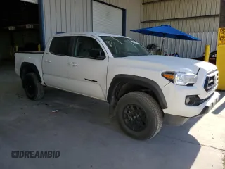 2023 Toyota Tacoma SR5 z VIN 3TMAZ5CN3PM219718, wystawiony jako Copart lot #55253845 z przebiegiem 18 879 mil mil oraz Szkody całkowita. Historia ofert i sprzedaży dostępna na DreamBid. Obrazek 4.