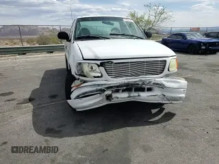 2004 Ford F-150 XL with VIN 2FTRF17294CA59985, listed as a Copart auction lot 55296195 with 220,933 mi miles and Salvage title. Bid and sale history available at DreamBid. Image 13.