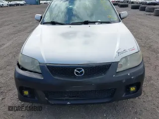 2002 Mazda Protege with VIN JM1BJ245921455563, listed as a IAAI auction lot 42064853 with Not Provided miles and . Bid and sale history available at DreamBid. Image 6.