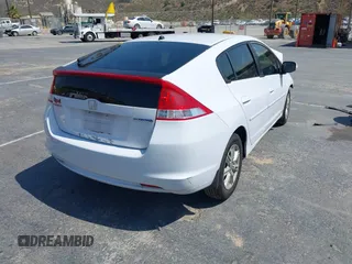 2010 Honda Insight EX with VIN JHMZE2H71AS012927, listed as a IAAI auction lot 42455037 with Not provided miles and . Bid and sale history available at DreamBid. Image 4.