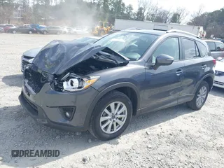 2015 Mazda CX-5 Touring with VIN JM3KE2CY2F0530204, listed as a IAAI auction lot 41788921 with 50,827 mi miles. Bid and sale history available at carsss.com. Image 2.