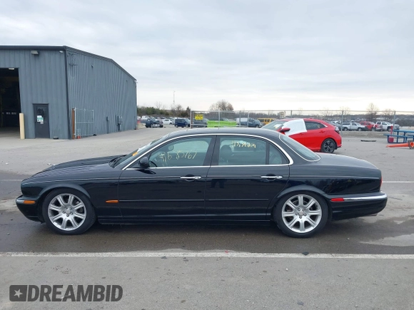 2004 Jaguar XJ with VIN SAJWA71C14SG20122, listed as a IAAI auction lot 41685767 with 113,392 mi miles. Bid and sale history available at carsss.com. Image 15.