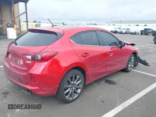 2018 Mazda 3 Touring with VIN 3MZBN1L33JM187560, listed as a IAAI auction lot 41692954 with 58,396 mi miles. Bid and sale history available at carsss.com. Image 4.
