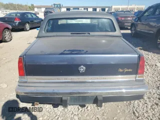 1990 Chrysler New Yorker z VIN 1C3XY66R4LD784183, wystawiony jako Copart lot #75364784 z przebiegiem 114 456 mil mil oraz Tytuł czysty. Historia ofert i sprzedaży dostępna na DreamBid. Obrazek 6.