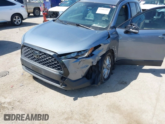 2023 Toyota Corolla Cross LE with VIN 7MUCAAAGXPV045651, listed as a IAAI auction lot 42006289 with 23,282 mi miles and . Bid and sale history available at DreamBid. Image 6.