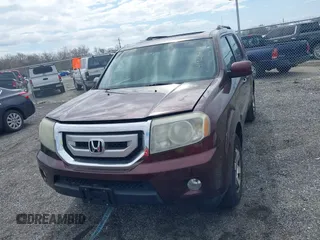 2010 Honda Pilot Touring with VIN 5FNYF4H95AB040721, listed as a IAAI auction lot 41928412 with 213,219 mi miles and . Bid and sale history available at carsss.com. Image 12.