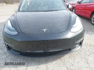 2022 Tesla Model 3 Long Range with VIN 5YJ3E1EB6NF343869, listed as a IAAI auction lot 41826077 with 36,643 mi miles and . Bid and sale history available at DreamBid. Image 11.