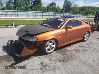2006 Hyundai Tiburon GT z VIN KMHHN65F66U191134, wystawiony jako Copart lot #56692615 z przebiegiem 197 093 mil mil oraz Szkoda całkowita • Salvage title. Historia ofert i sprzedaży dostępna na DreamBid. Obrazek 1.