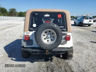 2000 Jeep Wrangler Sahara with VIN 1J4FA59SXYP764539, listed as a Copart auction lot 52707385 with 136,159 mi miles and Salvage title. Bid and sale history available at DreamBid. Image 6.