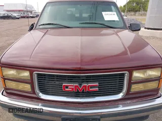 1999 GMC Suburban with VIN 1GKEC16R3XJ707787, listed as a IAAI auction lot 41826640 with 175,437 mi miles. Bid and sale history available at carsss.com. Image 6.