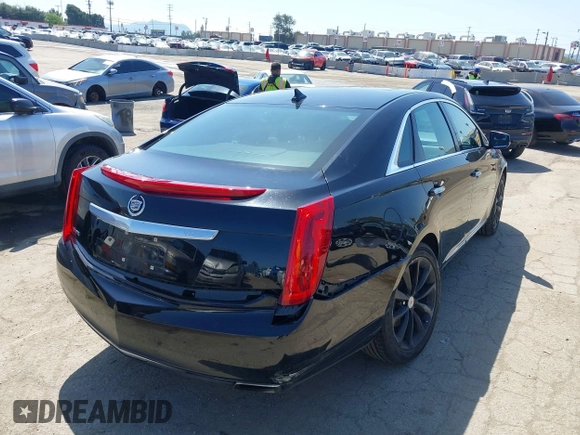 2013 Cadillac XTS Luxury z VIN 2G61P5S30D9220113, wystawiony jako IAAI lot #41970214 z przebiegiem 52 476 mil mil oraz . Historia ofert i sprzedaży dostępna na DreamBid. Obrazek 4.