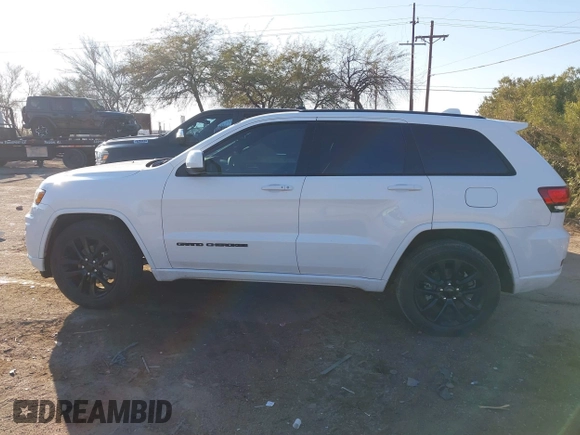 2020 Jeep Grand Cherokee Altitude with VIN 1C4RJEAG1LC251934, listed as a IAAI auction lot 41480299 with 74,169 mi miles and . Bid and sale history available at DreamBid. Image 14.