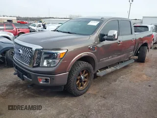 2016 Nissan Titan XD PRO-4X with VIN 1N6BA1F47GN504416, listed as a IAAI auction lot 41223650 with 168,440 mi miles. Bid and sale history available at carsss.com. Image 2.