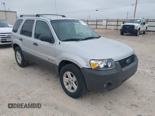 2006 Ford Escape Hybrid z VIN 1FMCU96H56KD26694, wystawiony jako IAAI lot #42369824 z przebiegiem 197 995 mil mil oraz . Historia ofert i sprzedaży dostępna na DreamBid. Obrazek 1.