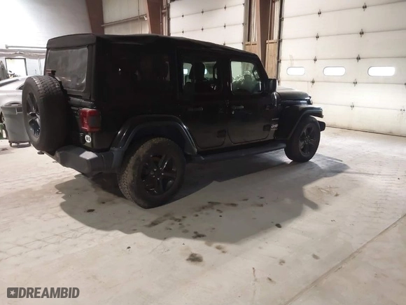 2019 Jeep Wrangler Unlimited Sahara with VIN 1C4HJXEG9KW579682, listed as a IAAI auction lot 41310472 with 74,265 mi miles. Bid and sale history available at carsss.com. Image 4.