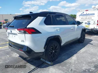 2024 Toyota RAV4 Hybrid XSE with VIN 2T3E6RFV9RW077941, listed as a IAAI auction lot 42012134 with 31,009 mi miles and . Bid and sale history available at DreamBid. Image 4.