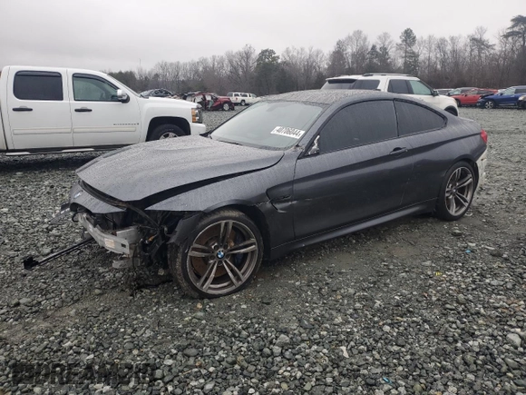 2015 BMW M4 with VIN WBS3R9C54FK330180, listed as a Copart auction lot 40706044 with 69,474 mi miles. Bid and sale history available at carsss.com. Image 1.