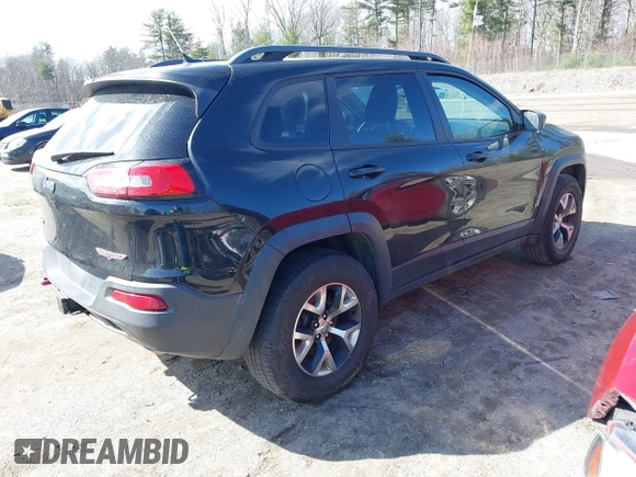 2014 Jeep Cherokee Trailhawk with VIN 1C4PJMBS3EW127749, listed as a IAAI auction lot 41836617 with 207,002 mi miles and . Bid and sale history available at DreamBid. Image 4.