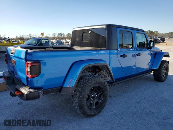 2023 Jeep Gladiator Mojave with VIN 1C6JJTEG7PL580727, listed as a Copart auction lot 48030215 with 12,707 mi miles and Salvage title. Bid and sale history available at DreamBid. Image 3.