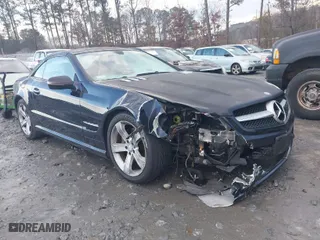 2009 Mercedes-Benz SL-Class V8 with VIN WDBSK71F29F143653, listed as a IAAI auction lot 41310556 with 115,377 mi miles. Bid and sale history available at carsss.com. Image 1.