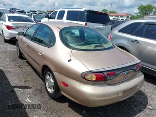 1997 Ford Taurus GL z VIN 1FALP52U9VA280563, wystawiony jako IAAI lot #42045413 z przebiegiem 219 484 mil mil oraz . Historia ofert i sprzedaży dostępna na DreamBid. Obrazek 3.