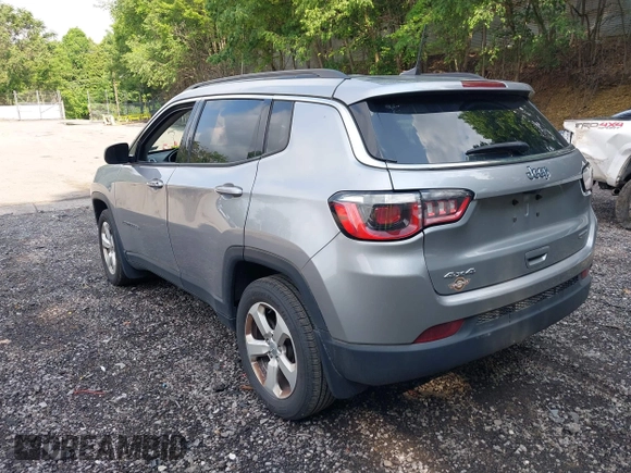 2018 Jeep Compass Latitude with VIN 3C4NJDBB8JT434339, listed as a IAAI auction lot 42404248 with 131,295 mi miles and . Bid and sale history available at DreamBid. Image 3.