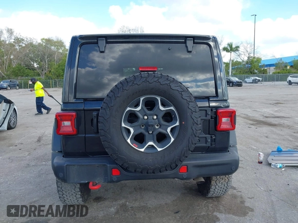 2023 Jeep Wrangler Rubicon with VIN 1C4HJXFGXPW534515, listed as a IAAI auction lot 41524419 with 21,376 mi miles and . Bid and sale history available at DreamBid. Image 16.