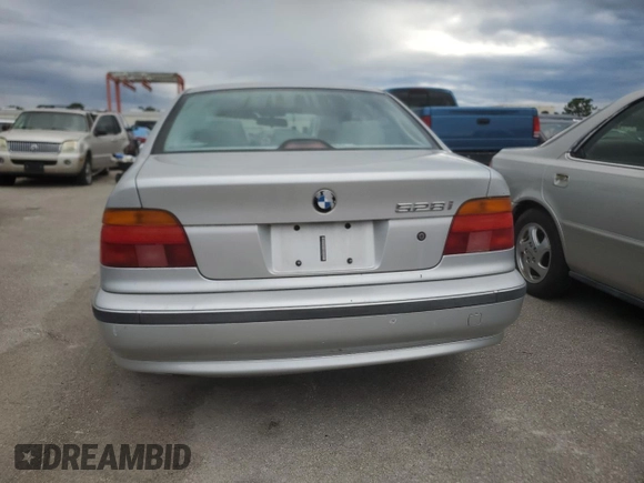 1999 BMW 5 Series 528iA with VIN WBADM6332XBY30585, listed as a Copart auction lot 74830704 with 0 mi miles and Salvage Title. Bid and sale history available at carsss.com. Image 6.