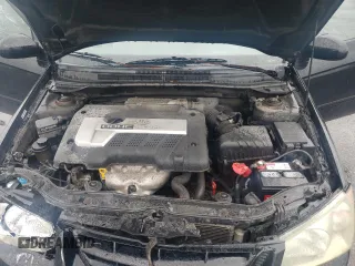 2005 Kia Spectra LX with VIN KNAFE121055134568, listed as a Copart auction lot 71541244 with 146,751 mi miles and Salvage Title. Bid and sale history available at carsss.com. Image 12.
