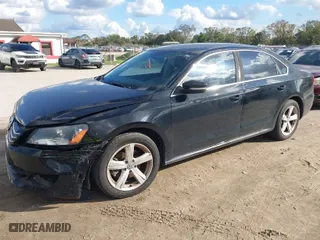 2014 Volkswagen Passat SE w/Sunroof with VIN 1VWBT7A30EC055472, listed as a IAAI auction lot 40975011 with 133,967 mi miles. Bid and sale history available at carsss.com. Image 2.