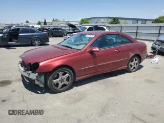 2004 Mercedes-Benz CLK 500 with VIN WDBTJ75JX4F107465, listed as a Copart auction lot 63126935 with 80,586 mi miles and Salvage title. Bid and sale history available at DreamBid. Image 1.