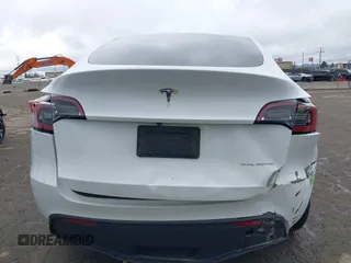 2023 Tesla Model Y Long Range with VIN 7SAYGDEE1PA106057, listed as a IAAI auction lot 41778642 with 1 mi miles. Bid and sale history available at carsss.com. Image 17.