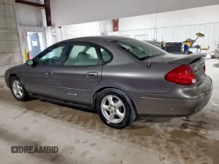 2002 Ford Taurus SES Standard z VIN 1FAFP55U72A161401, wystawiony jako Copart lot #55893125 z przebiegiem 128 258 mil mil oraz Czysty tytuł • Clean title. Historia ofert i sprzedaży dostępna na DreamBid. Obrazek 2.
