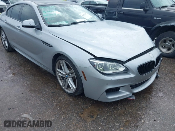 2015 BMW 6 Series 640i z VIN WBA6A0C51FD318982, wystawiony jako IAAI lot #41875547 z przebiegiem 60 968 mil mil oraz . Historia ofert i sprzedaży dostępna na DreamBid. Obrazek 19.
