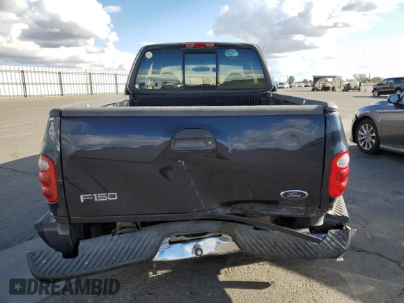 2000 Ford F-150 with VIN 1FTRX07W3YKA56561, listed as a Copart auction lot 81149654 with 185,967 mi miles and Salvage title. Bid and sale history available at DreamBid. Image 6.