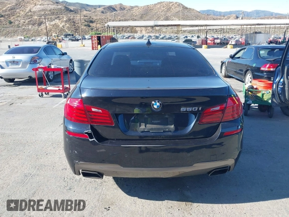 2015 BMW 5 Series 550i with VIN WBAKN9C56FD961027, listed as a IAAI auction lot 42653452 with 167,493 mi miles and . Bid and sale history available at DreamBid. Image 16.
