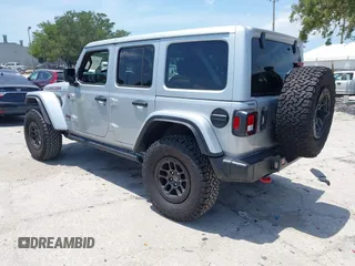2023 Jeep Wrangler Rubicon with VIN 1C4JJXFG0PW522651, listed as a IAAI auction lot 42112210 with 7,744 mi miles and . Bid and sale history available at carsss.com. Image 3.