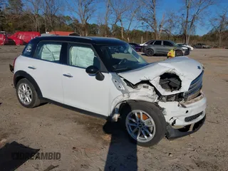 2015 MINI Countryman with VIN WMWZB3C53FWR43884, listed as a IAAI auction lot 41296213 with 111,934 mi miles and . Bid and sale history available at DreamBid. Image 1.