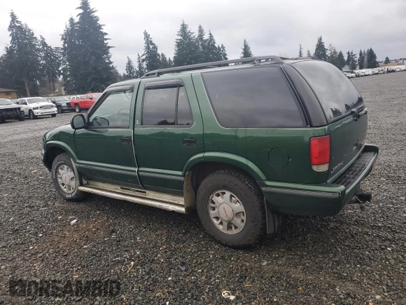 1997 GMC Jimmy SLS with VIN 1GKDT13WXV2563104, listed as a Copart auction lot 86317834 with 121,791 mi miles and Salvage Title. Bid and sale history available at carsss.com. Image 2.