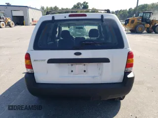 2004 Ford Escape XLS with VIN 1FMYU021X4DA07352, listed as a Copart auction lot 68909864 with 275,776 mi miles and Salvage Title. Bid and sale history available at carsss.com. Image 6.