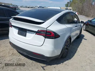 2023 Tesla Model X with VIN 7SAXCDE50PF414198, listed as a IAAI auction lot 41880957 with Not Provided miles and . Bid and sale history available at DreamBid. Image 4.