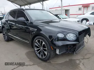 2022 Bentley Bentayga V8 z VIN SJAAM2ZV1NC013849, wystawiony jako IAAI lot #42176939 z przebiegiem 15 292 mil mil oraz . Historia ofert i sprzedaży dostępna na DreamBid. Obrazek 1.