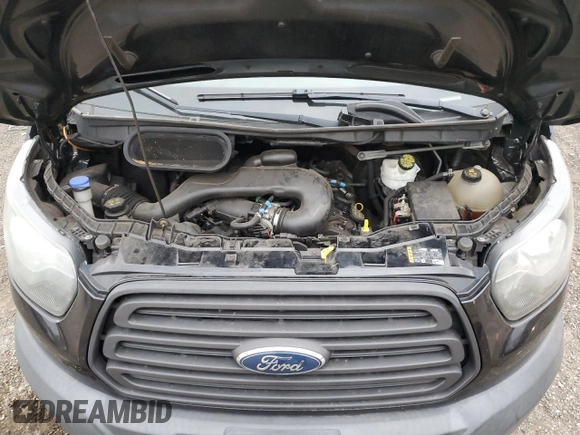 2016 Ford Transit Cargo z VIN 1FTYE1YM4GKA61271, wystawiony jako Copart lot #87135384 z przebiegiem 177 741 mil mil oraz Szkoda całkowita • Salvage title. Historia ofert i sprzedaży dostępna na DreamBid. Obrazek 12.