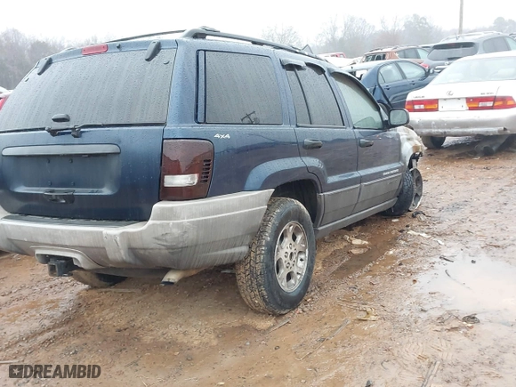 1999 Jeep Grand Cherokee Laredo with VIN 1J4GW58N3XC760274, listed as a IAAI auction lot 41541029 with 1 mi miles. Bid and sale history available at carsss.com. Image 4.