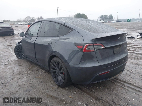 2022 Tesla Model Y Performance with VIN 7SAYGDEF1NF379167, listed as a IAAI auction lot 41429842 with 86,582 mi miles and . Bid and sale history available at DreamBid. Image 3.