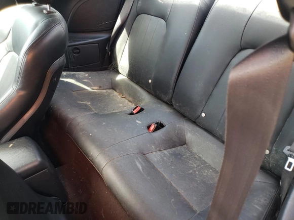 2003 Hyundai Tiburon GT z VIN KMHHN65F13U084620, wystawiony jako Copart lot #46880185 z przebiegiem Nie podano mil oraz Nie do naprawy • Non repairable. Historia ofert i sprzedaży dostępna na DreamBid. Obrazek 10.