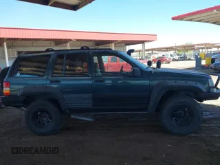 1994 Jeep Grand Cherokee Laredo with VIN 1J4GZ58S4RC280650, listed as a IAAI auction lot 42041261 with 199,265 mi miles and . Bid and sale history available at DreamBid. Image 13.
